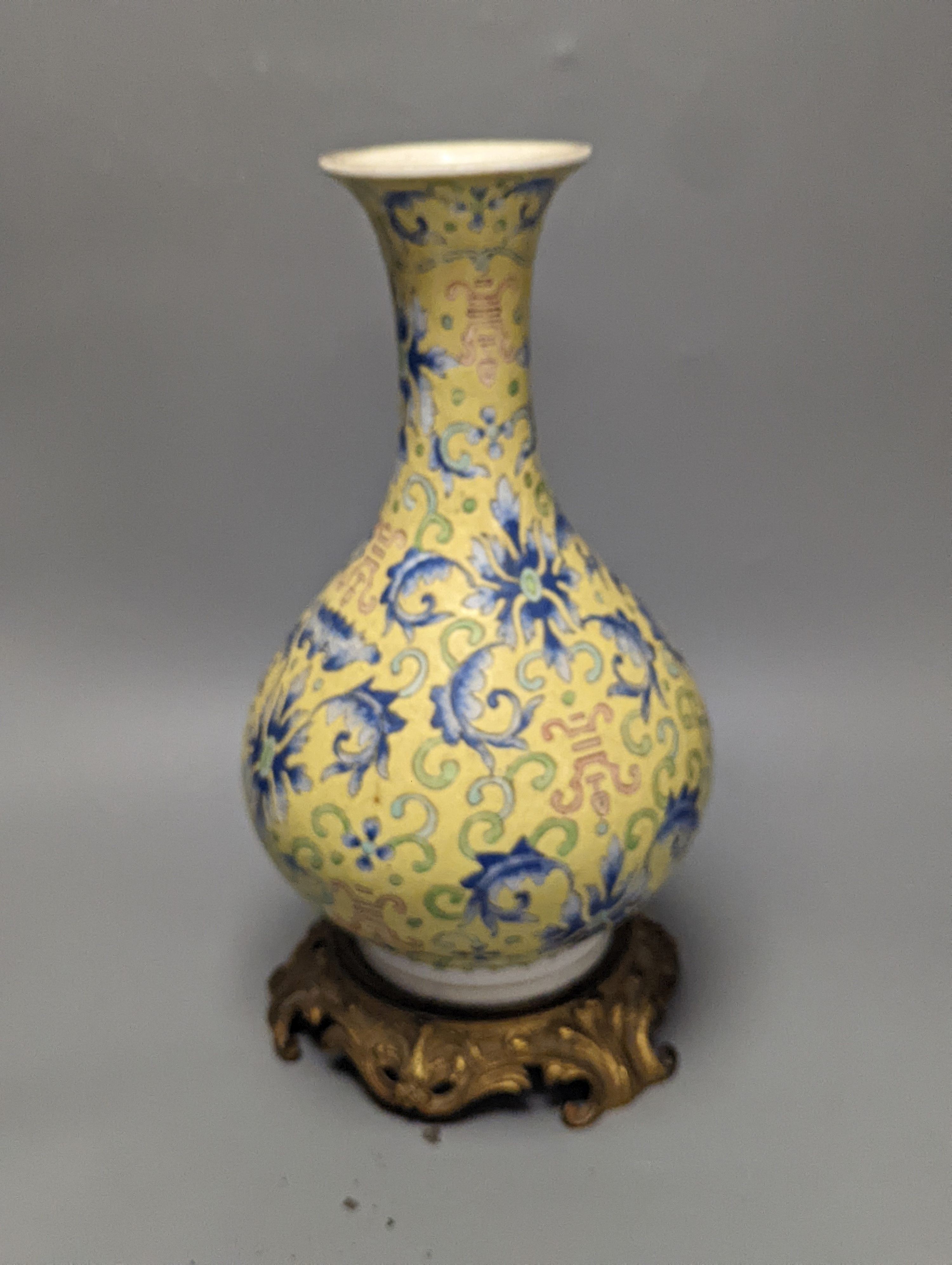 A Chinese yellow ground vase, raised on a gilt bronze base 38cm